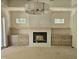 Cozy living room with a modern fireplace and custom built-ins at 109 Evander Way, Pittsboro, NC 27312