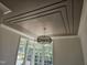 Living room offers a unique layered ceiling with lighting and natural light at 109 Evander Way, Pittsboro, NC 27312