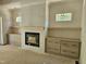 Bright living room with a modern fireplace and built-in shelving at 109 Evander Way, Pittsboro, NC 27312