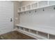 Mudroom with built-in shelving, coat hooks, and bench seating at 109 Evander Way, Pittsboro, NC 27312