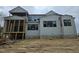 Home exterior features wood frame porch, neutral siding, and multiple window placements at 109 Evander Way, Pittsboro, NC 27312