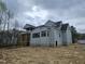 Home exterior with porch, neutral siding, and window placement offers great potential at 109 Evander Way, Pittsboro, NC 27312