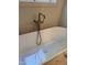 Elegant freestanding bathtub with brushed bronze faucet and fixtures at 129 Windel Dr, Raleigh, NC 27609