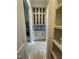 Butler pantry with glass-front cabinets, blue backsplash, and stainless oven at 129 Windel Dr, Raleigh, NC 27609