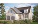 Exterior rendering of a charming two-story home with a landscaped yard, two car garage, and covered front porch at 129 Windel Dr, Raleigh, NC 27609