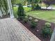 Beautifully landscaped garden bed with fresh mulch and a variety of plants at 129 Windel Dr, Raleigh, NC 27609