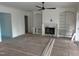 Spacious living room features a fireplace, built-in bookshelves, and ample natural light at 129 Windel Dr, Raleigh, NC 27609