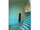 An interior view of a stairway with a storage area beneath and modern lighting fixtures at 129 Windel Dr, Raleigh, NC 27609