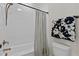 Bathroom featuring a tiled shower and tub combination, and decorative hand towels on a towel rack at 1300 Broad St # A, Durham, NC 27705