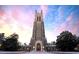 Exterior of historic chapel with impressive architecture against a backdrop of a colorful sunset at 1300 Broad St # A, Durham, NC 27705