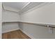 Walk-in closet with custom shelving and hardwood floors at 1300 Broad St # A, Durham, NC 27705