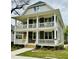 Charming two-story home with a double front porch, white railings, and a well-manicured lawn at 1300 Broad St # A, Durham, NC 27705