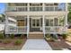 Inviting exterior view showcasing the building's double porches supported by stately columns at 1300 Broad St # A, Durham, NC 27705
