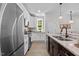 Bright kitchen with stainless steel appliances, granite counters and a window at 1300 Broad St # A, Durham, NC 27705