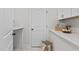 Bright laundry room with lots of shelf space and marble countertops at 1300 Broad St # A, Durham, NC 27705