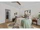Stylishly furnished main bedroom with ceiling fan and lots of natural light at 1300 Broad St # A, Durham, NC 27705