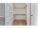 Spacious walk-in closet with shelving and hanging rods at 1300 Broad St # B, Durham, NC 27705