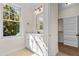 Bathroom with vanity and walk-in closet at 1300 Broad St # C, Durham, NC 27705