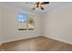 Bright bedroom with hardwood floors and ceiling fan at 1300 Broad St # C, Durham, NC 27705