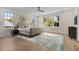 Main bedroom with hardwood floors and large windows at 1300 Broad St # C, Durham, NC 27705