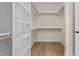 Walk-in closet with shelving and hanging rods at 1300 Broad St # C, Durham, NC 27705
