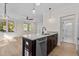 Open kitchen with island, granite countertops, and stainless steel appliances at 1300 Broad St # C, Durham, NC 27705