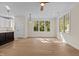 Bright living room with hardwood floors and large windows at 1300 Broad St # C, Durham, NC 27705