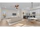 Open living room and kitchen with hardwood floors and modern appliances at 1300 Broad St # C, Durham, NC 27705