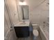 Compact bathroom featuring a vanity, mirror, toilet, and shower-tub combination at 19 Grassland Dr, Garner, NC 27529