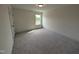 Cozy bedroom featuring carpeted floors, one window, and ample space for relaxation and personalization at 19 Grassland Dr, Garner, NC 27529