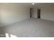Large bedroom with carpet, and multiple entry points to other parts of the home at 19 Grassland Dr, Garner, NC 27529