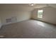 Spacious carpeted bonus room is bright with natural light from a large window at 19 Grassland Dr, Garner, NC 27529