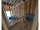 Interior garage framing with door and flooring at 19 Grassland Dr, Garner, NC 27529