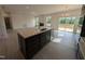 Spacious kitchen with stainless steel appliances, quartz island, and open to living room at 19 Grassland Dr, Garner, NC 27529