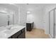 Main bathroom with double vanity, quartz countertop, and two showers at 2000 Regal Dr # 88, Durham, NC 27703