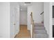 Bright entryway with hardwood floors, staircase, and interior doors at 2000 Regal Dr # 88, Durham, NC 27703