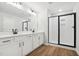 Modern bathroom with double vanity, white cabinets, and a glass shower at 2006 Regal Dr # 85, Durham, NC 27703