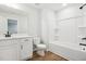 Modern bathroom with white vanity, bathtub, and shower at 2006 Regal Dr # 85, Durham, NC 27703