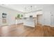 Modern kitchen with white cabinets, island, and stainless steel appliances at 2006 Regal Dr # 85, Durham, NC 27703