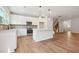 Open concept kitchen with white cabinets and an island at 2006 Regal Dr # 85, Durham, NC 27703
