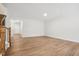 Open living area with hardwood floors and access to the kitchen at 2006 Regal Dr # 85, Durham, NC 27703