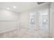 Upstairs hallway with carpet and doors to bedrooms at 2006 Regal Dr # 85, Durham, NC 27703