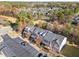 Aerial view of townhouses with parking and surrounding community at 207 Hampshire Downs Dr, Morrisville, NC 27560