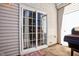 Back patio with sliding glass door and grill at 207 Hampshire Downs Dr, Morrisville, NC 27560