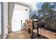 Back patio with white door and rusty grill at 207 Hampshire Downs Dr, Morrisville, NC 27560