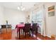Charming dining room with hardwood floors and a wood table at 207 Hampshire Downs Dr, Morrisville, NC 27560