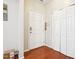 Bright entryway with hardwood floors and a white door at 207 Hampshire Downs Dr, Morrisville, NC 27560