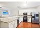 Modern kitchen with stainless steel appliances and granite countertops at 207 Hampshire Downs Dr, Morrisville, NC 27560