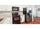 Modern kitchen with stainless steel appliances and granite countertops at 207 Hampshire Downs Dr, Morrisville, NC 27560