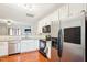 Modern kitchen with stainless steel appliances and granite countertops at 207 Hampshire Downs Dr, Morrisville, NC 27560